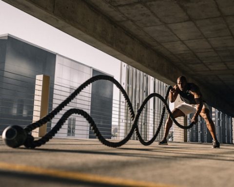 Man working out in a parking deck