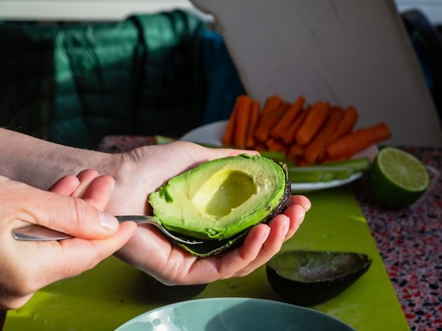 Picture of someone eating an avocado